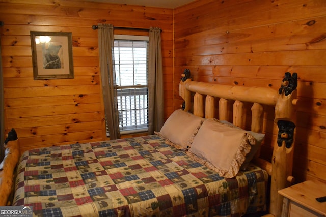 bedroom with wooden walls