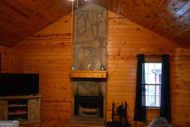 living room featuring a stone fireplace, wood walls, wood ceiling, vaulted ceiling, and hardwood / wood-style floors