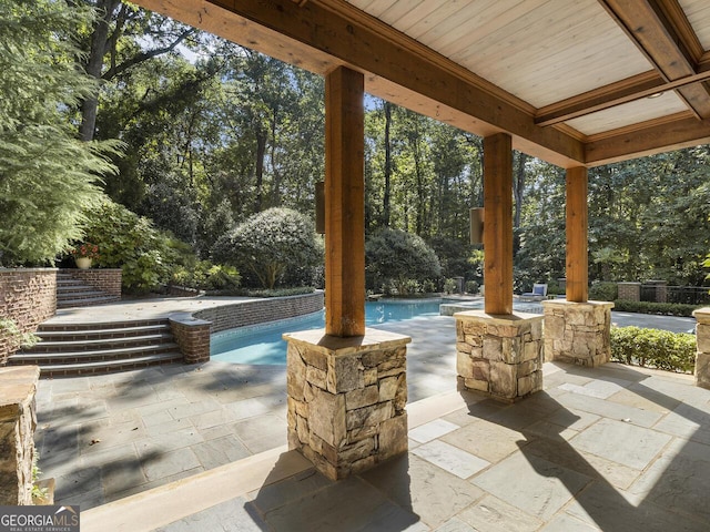 4345 Mount Paran Pkwy NW, Atlanta, GA 30327 - view of patio / terrace featuring an outdoor pool and view of wooded area