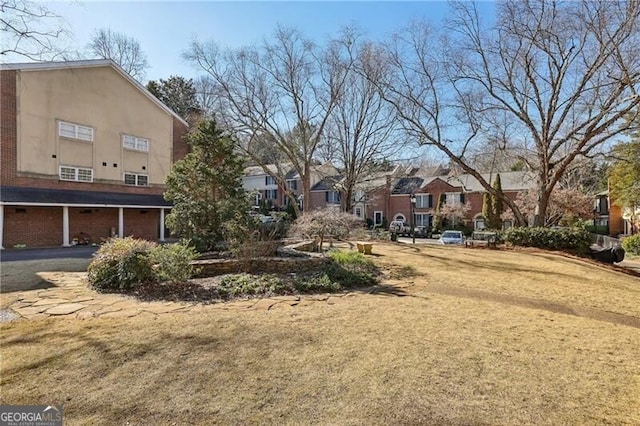 view of yard featuring a residential view