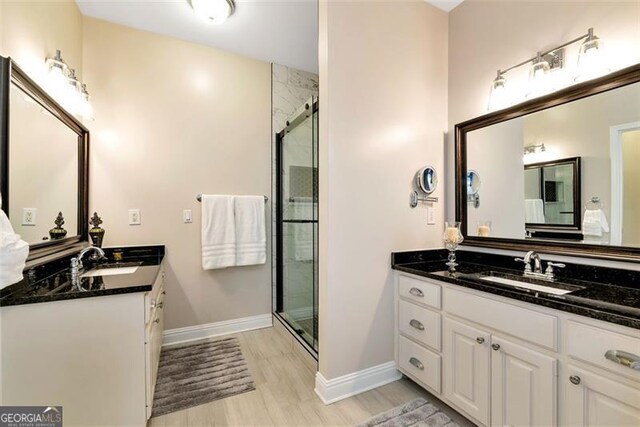 washroom with sink, washer and dryer, crown molding, and cabinets