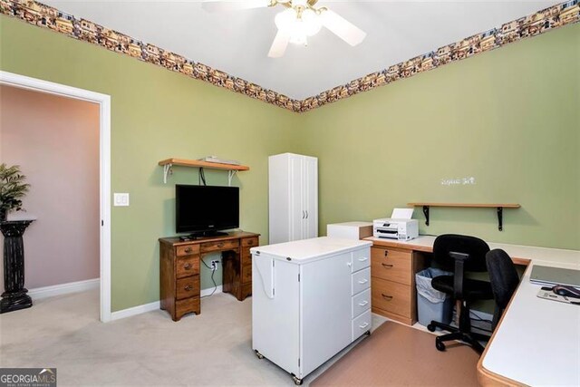 carpeted bedroom featuring ceiling fan, crown molding, and a raised ceiling