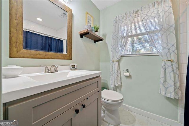 bathroom with toilet, tile patterned floors, walk in shower, and vanity