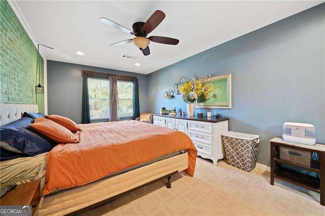 bedroom with light carpet and ceiling fan