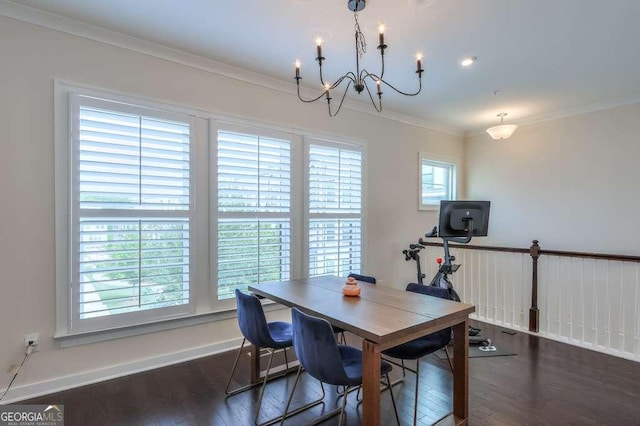 dining area with dark hardwood / wood-style flooring, crown molding, and a notable chandelier