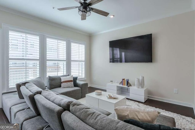 living room with ceiling fan, dark hardwood / wood-style floors, and crown molding