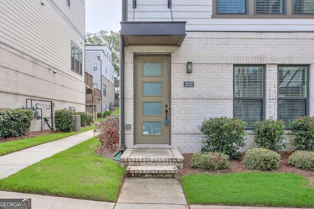 entrance to property with a yard