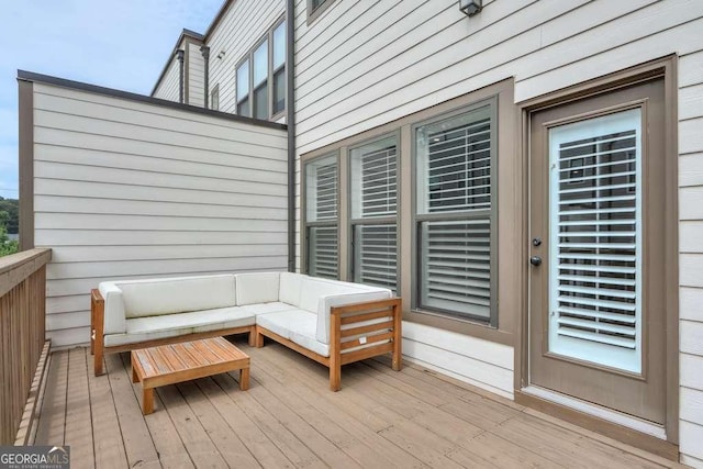 wooden terrace featuring outdoor lounge area