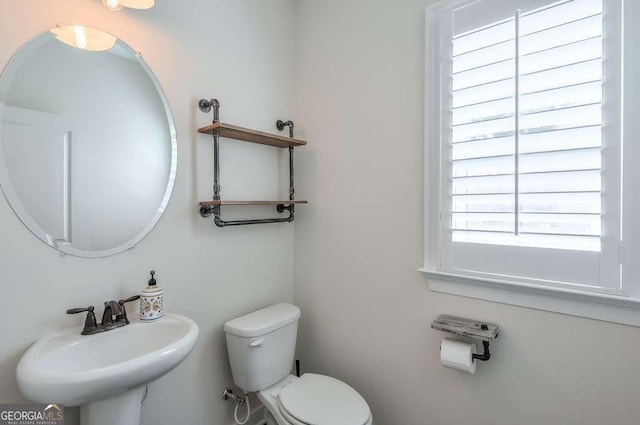 bathroom with toilet and sink