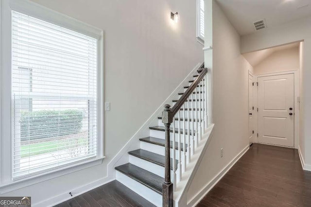 stairs with wood-type flooring