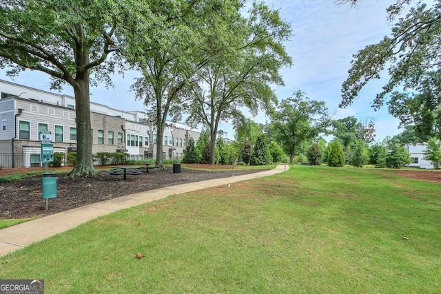 view of home's community with a lawn