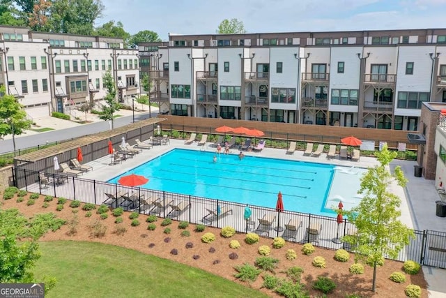 view of swimming pool with a patio area