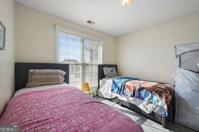 bedroom featuring a textured ceiling