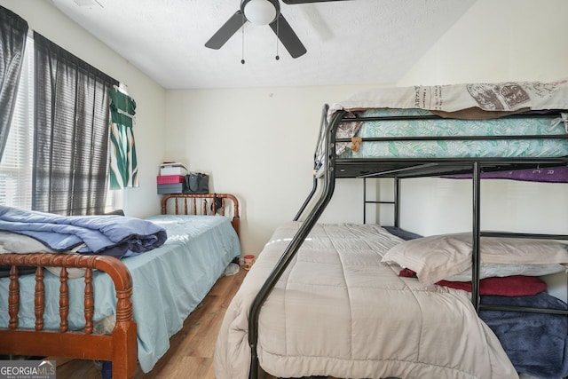 bedroom with hardwood / wood-style flooring and ceiling fan