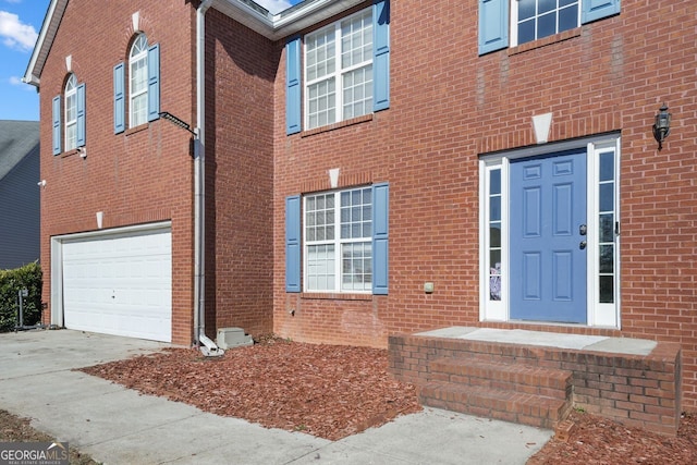 doorway to property featuring a garage