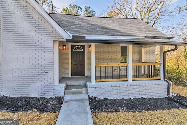 entrance to property featuring a porch