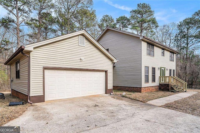 view of side of home featuring a garage