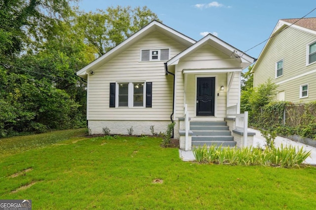 bungalow with a front lawn