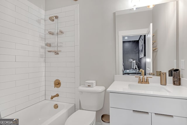 full bathroom with toilet, vanity, and tiled shower / bath