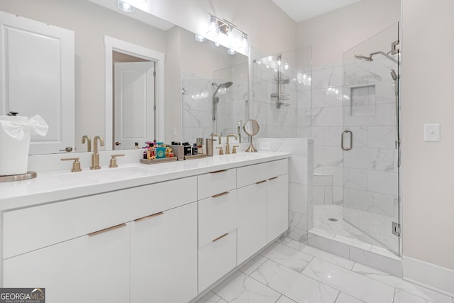 bathroom with a shower with shower door and vanity