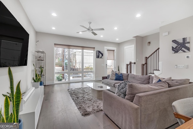 living room with ceiling fan and wood-type flooring