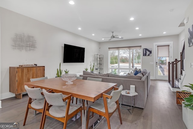 dining space with ceiling fan and hardwood / wood-style floors