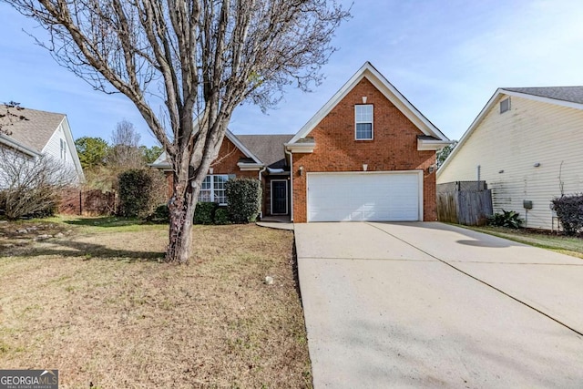 view of property with a front yard and a garage