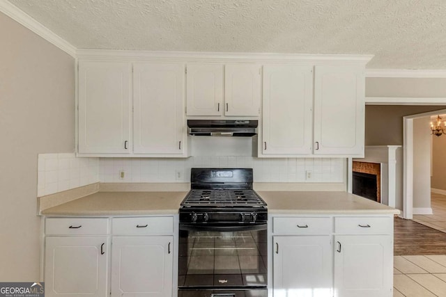 kitchen with white cabinetry, black range with gas stovetop, and light tile patterned flooring