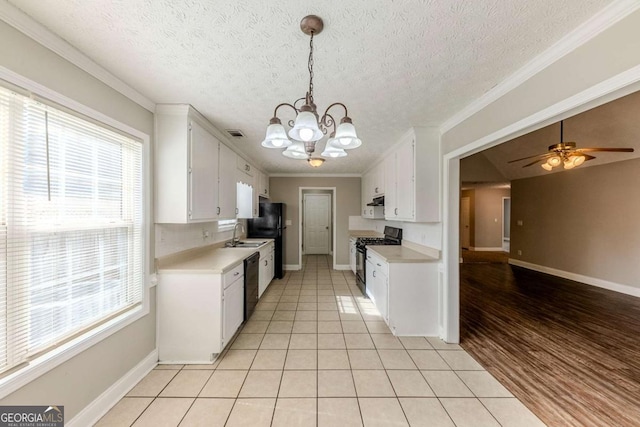 kitchen with white cabinetry, black appliances, ornamental molding, and light tile patterned flooring