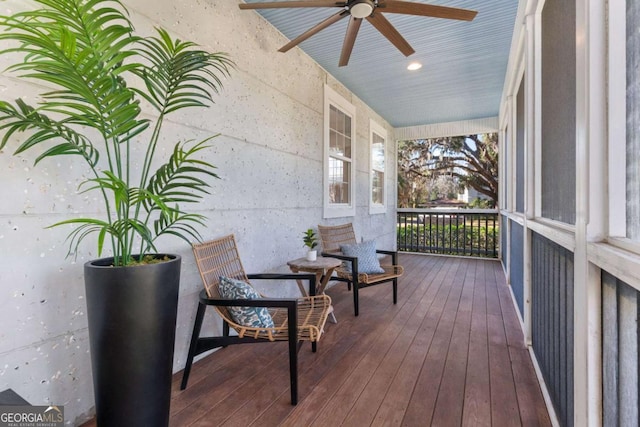 deck featuring ceiling fan and a porch