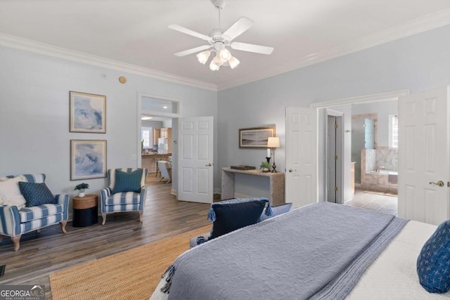 bedroom featuring ceiling fan, ensuite bathroom, ornamental molding, and hardwood / wood-style flooring