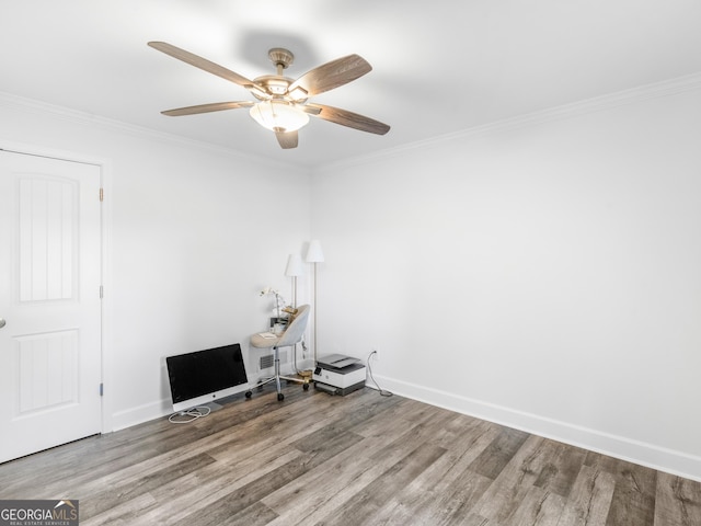 spare room with ceiling fan, hardwood / wood-style floors, and crown molding