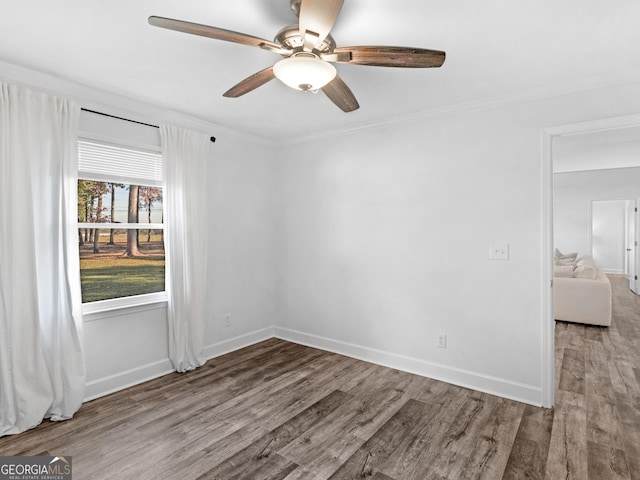 unfurnished room featuring ceiling fan, ornamental molding, and hardwood / wood-style floors