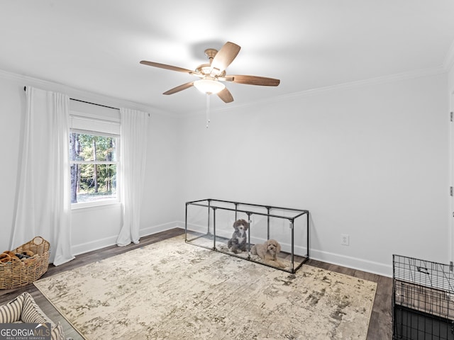 unfurnished room with ceiling fan, ornamental molding, and hardwood / wood-style flooring