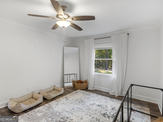 unfurnished bedroom featuring ceiling fan, ornamental molding, and hardwood / wood-style flooring