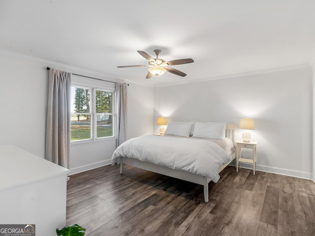 bedroom featuring ceiling fan, ornamental molding, and dark hardwood / wood-style floors