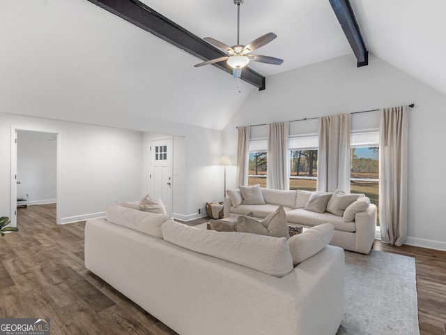 living room with ceiling fan, dark wood-type flooring, and lofted ceiling with beams