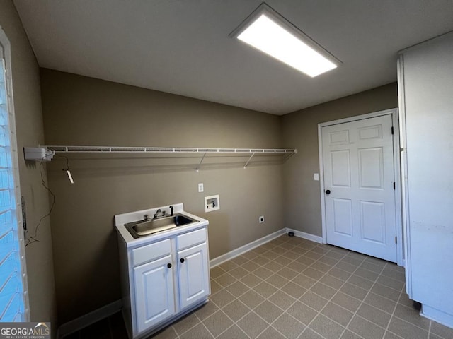 laundry area with electric dryer hookup, sink, hookup for a washing machine, and cabinets