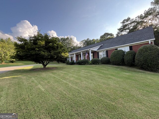 view of property's community with a lawn