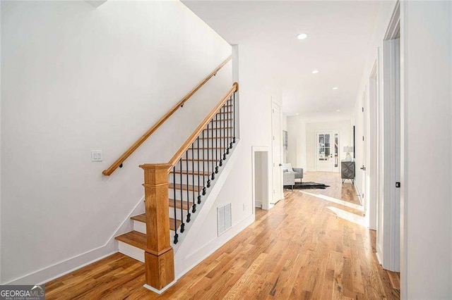 interior space featuring baseboards, wood finished floors, visible vents, and recessed lighting