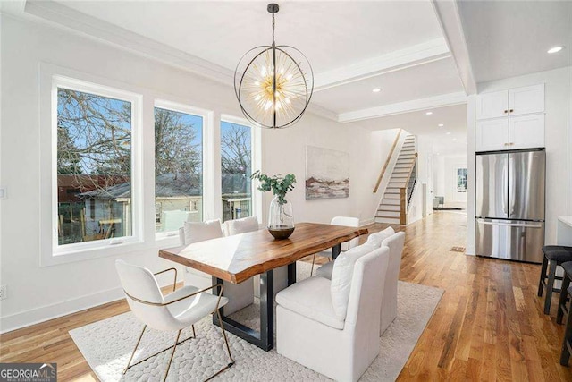 dining room featuring light wood-style floors, stairs, baseboards, and an inviting chandelier