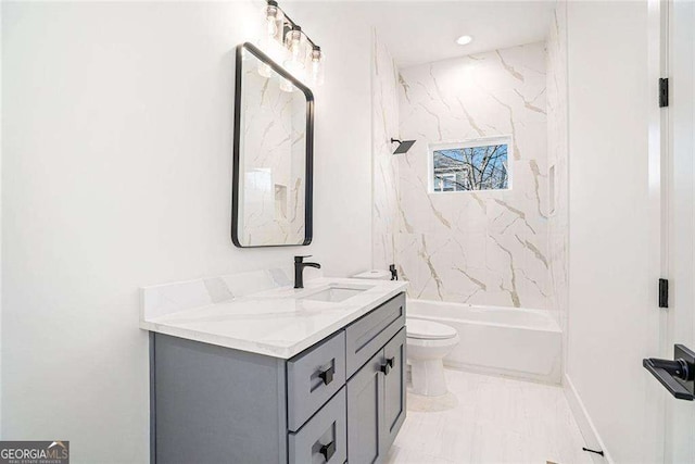 bathroom featuring  shower combination, vanity, and toilet