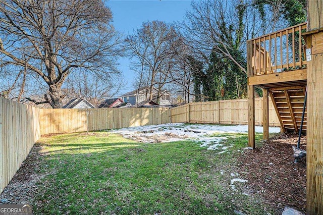 view of yard featuring stairs and a fenced backyard