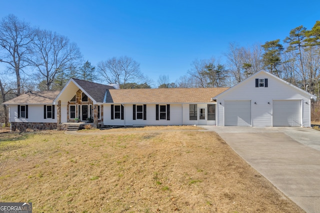 ranch-style home with a front lawn and a garage