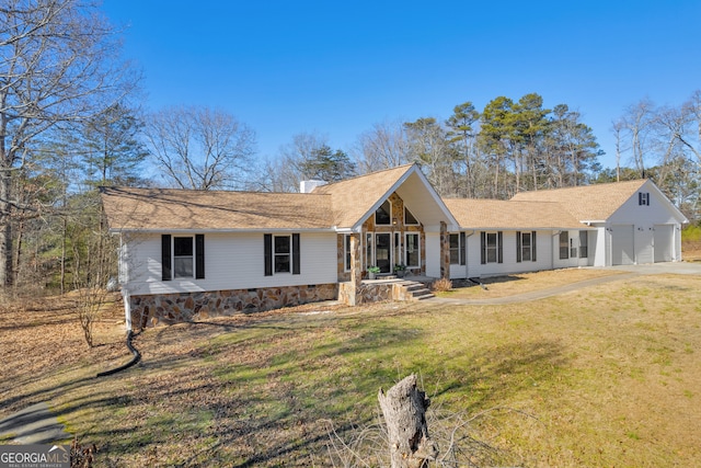 single story home with a front lawn and a garage