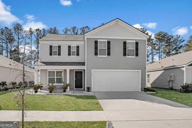 front of property with a front yard and a garage