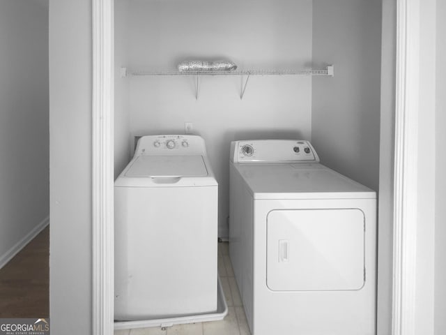 washroom featuring independent washer and dryer