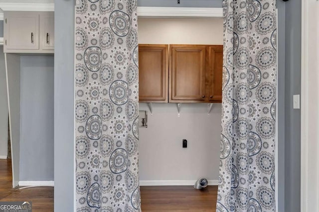 laundry room with dark hardwood / wood-style flooring