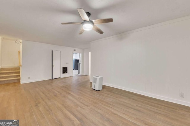 spare room with ceiling fan and light hardwood / wood-style floors