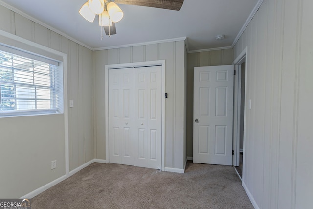 1883 La Mesa Ln, Decatur, GA 30032 - unfurnished bedroom featuring crown molding, light colored carpet, ceiling fan, and a closet